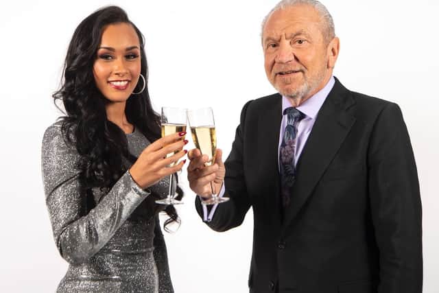 The winner of the latest series of the BBC programme The Apprentice, Sian Gabbidon from Leeds, celebrates with Lord Sugar in London. PIC: Victoria Jones/PA Wire