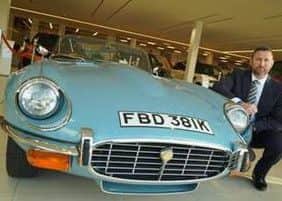 MEAN MACHINE: Robert Bowland, general manager at Farnell Jaguar Leeds, with the classic E-Type Series 3 W12 Roadster.