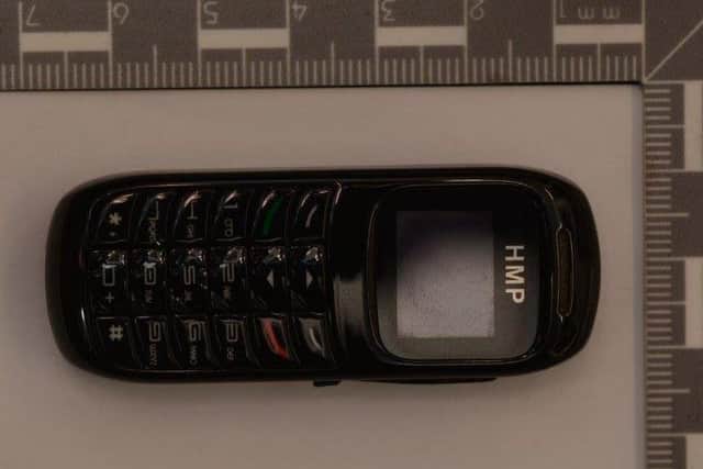 A contraband mobile phone measuring only seven centimetres which was recovered by Leeds District Prison Crime Team.