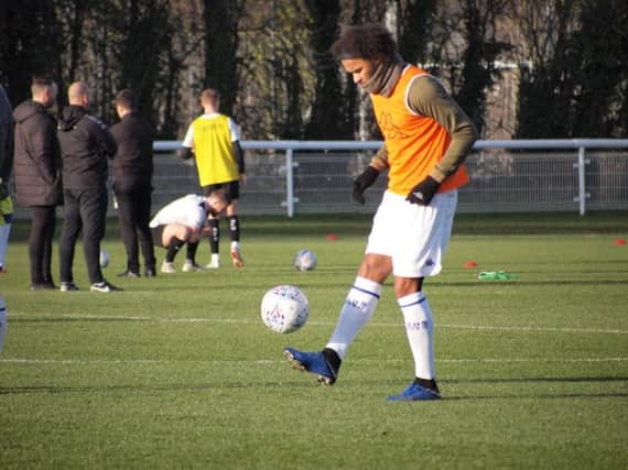 Izzy Brown warming up ahead of Leeds United's development squad clash against Barnsley today. He limped off in the first half.