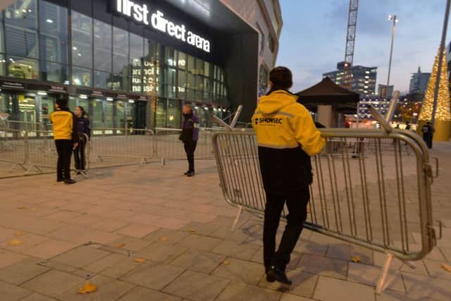 Showsec stewards get the barriers set up outside the arena.  Picture: Bruce Rollinson