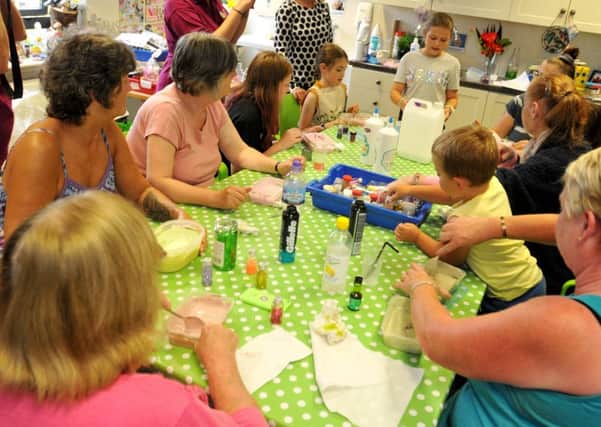 WIGAN  30-07-18 Annie Fletcher, ten, holds a slime workshop for patients and their families at The Oak Centre at Wigan and Leigh hospice.
