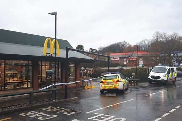 Police guard the scene at McDonalds on Killingbeck Road after an armed robbery