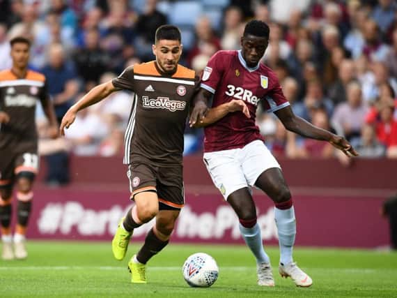 Axel Tuanzebe (R) in action against Brentford.