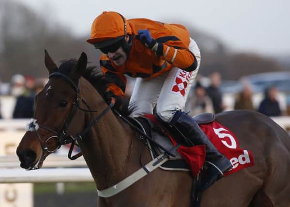 Winners: Tom Scudamore rides Thistlecrack to King George success in 2016.