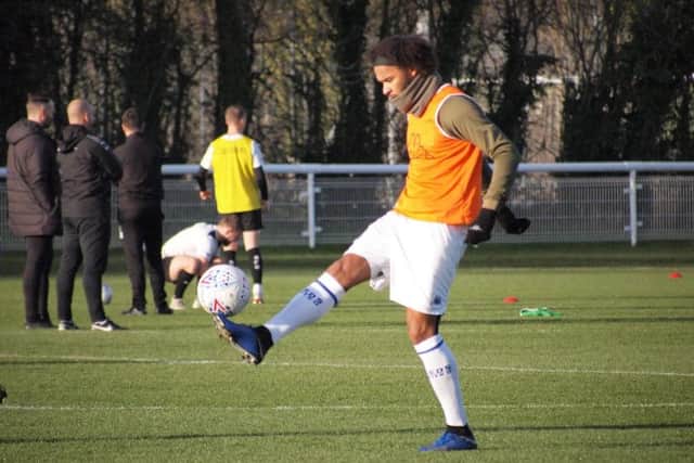 Leeds United's Izzy Brown warms up at Thorp Arch.