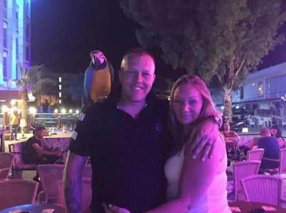 Martin and Lindsey Brown of Chorley posing with a parrot on holiday