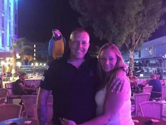 The couple posed with a parrot at their hotel when they were supposed to be ill