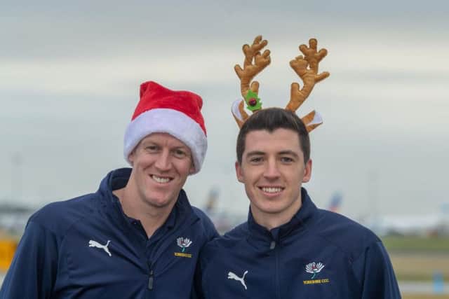 Yorkshire cricketers Steven Patterson and Matthew Fisher deliver presents to Martin House Hospice at Boston Spa.