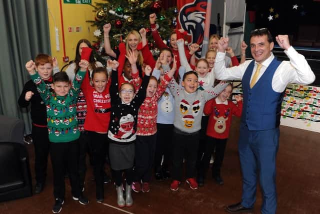 Headteacher Chris Dyson celebrates with teachers and students at Parklands Primary School. Picture: Tony Johnson.
