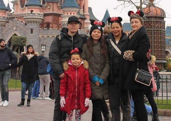 Vicki Aldwin (right) with family members on a trip to Disneyland Paris