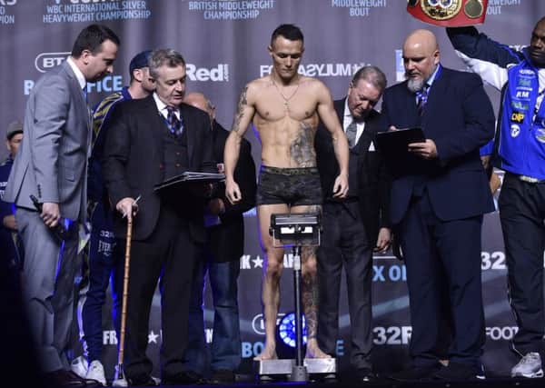 Josh Warrington weighs in for his fight with Carl Frampton.