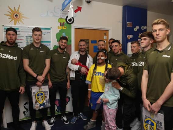 FESTIVE CHEER: Pontus Jansson, left, and some of his Leeds United team mates visit children's wards at LGI.
