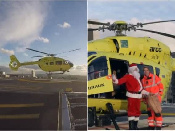 Father Christmas aka Santa Claus lands on the roof of Leeds General Infirmary. Photos & Video: Yorkshire Ambulance Service/Twitter