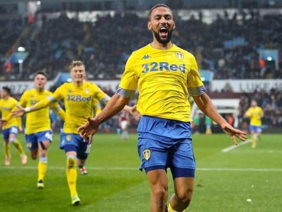 SIX APPEAL: Leeds United striker Kemar Roofe celebrates his 95th-minute winner at Aston Villa with Gjanni Alioski close behind, a success that made it six wins in succession.