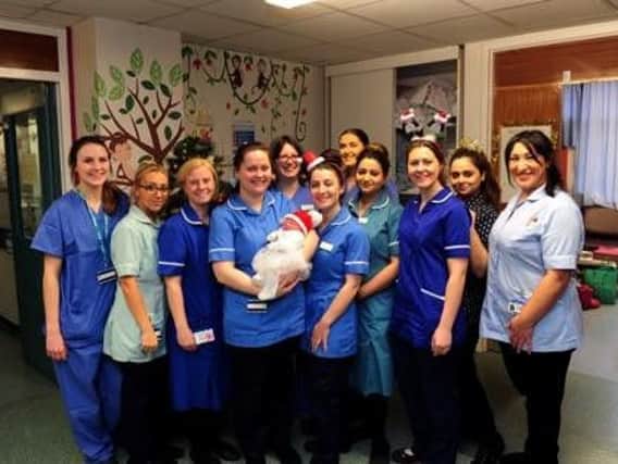 Ada May Ainsley-Moss, pictured with staff at St James's Hospital, Leeds following her birth in the early hours of Christmas Day. Picture by Simon Hulme.
