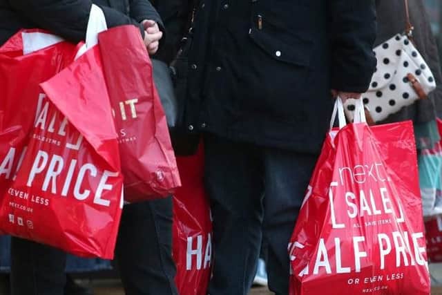 Shoppers leave Next this morning.
