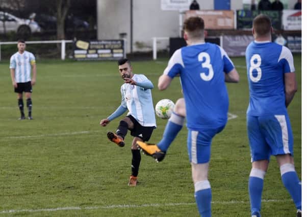 Anees Younis scores the winner for Carlton Athletic in their 2-1 victory over Whitkirk Wanderers. Picture: Steve Riding.