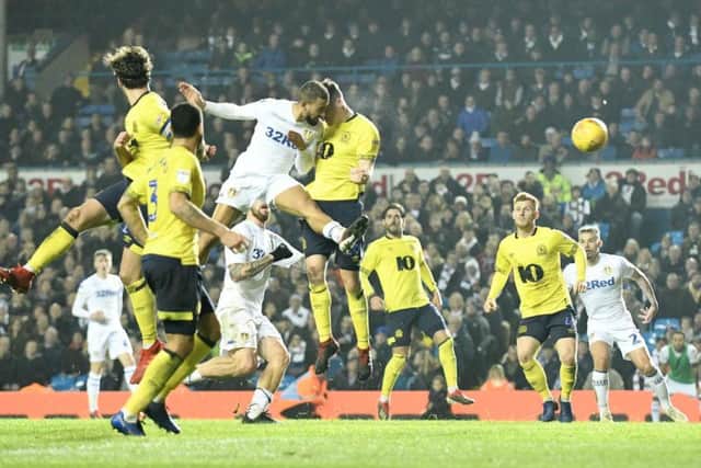 Leeds United striker Kemar Roofe heads home a 95th minute winner against Blackburn Rovers.