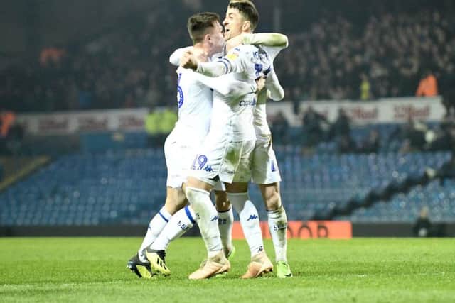 Leeds United's players celebrate the late winning goal.