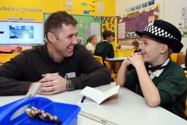 David Jackson of the LED Community Foundation chats to junior detective Tomas Robinson, aged nine, of Farsley Springbank School.