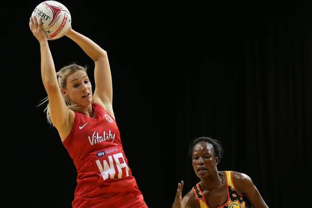 England Roses' Natalie Haythornthwaite (left) in action during the Vitality Netball International Series match at The Echo Arena, Liverpool last month (Picture: Nigel French/PA Wire)