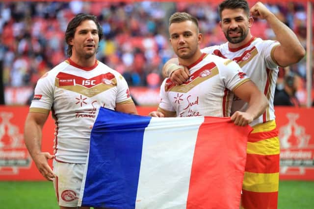 Catalan Dragons' Julian Bousquet (left), Josh Drinkwater (centre) and Mickael Simon celebrate after the Ladbrokes Challenge Cup Final at Wembley Stadium (Picture: Adam Davy/PA Wire)