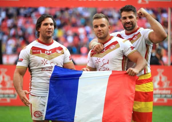 Catalan Dragons' Julian Bousquet (left), Josh Drinkwater (centre) and Mickael Simon celebrate after the Ladbrokes Challenge Cup Final at Wembley Stadium (Picture: Adam Davy/PA Wire)