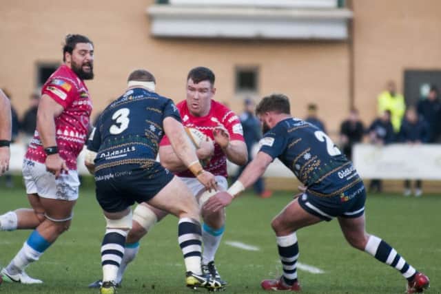 On the charge: Doncaster's Oliver Steadman tests the Carnegie defence.