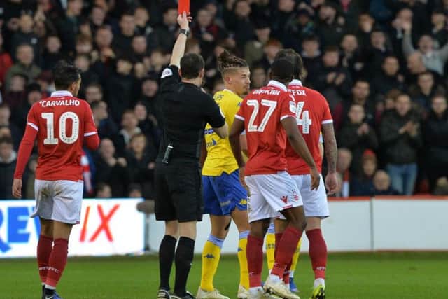 Leeds United midfielder Kalvin Phillips is shown a straight red card.