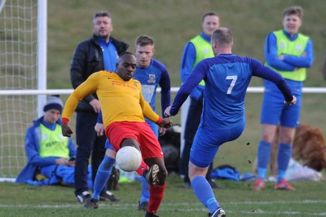 Stefan Small wins the ball for Aberford Albion against Kirk Deighton, a match abandoned in the second half by the referee. PIC: Steve Riding