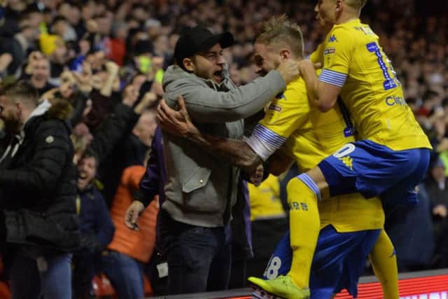 Leeds United defender Gaetano Berardi celebrates with his team-mates from the away end at Nottingham Forest.
