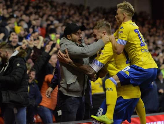 Leeds United defender Gaetano Berardi celebrates with his team-mates from the away end at Nottingham Forest.