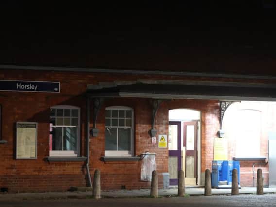 The scene at Horsley station near Guildford, Surrey, after a murder inquiry was launched following the stabbing of a man on board a train.