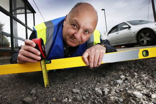 TAKING EXTREME MEASURES:  Mr Pothole Mark Morrell visits Kennington to inspect the potholes in one of Londons wealthiest boroughs in a scene from the new ITV documentary.