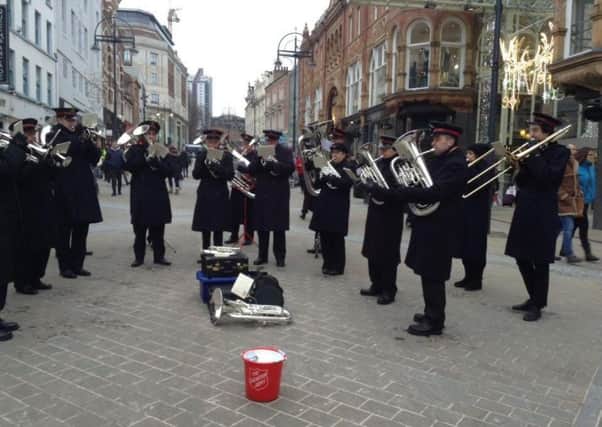 MUSIC: A Salvation Army brass band pipes up in Leeds city centre.