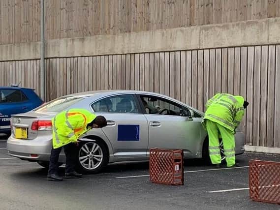 Police conducting checks on taxis. Photos: West Yorkshire Police