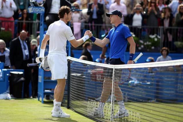 Handing over: Andy Murray and Kyle Edmund.