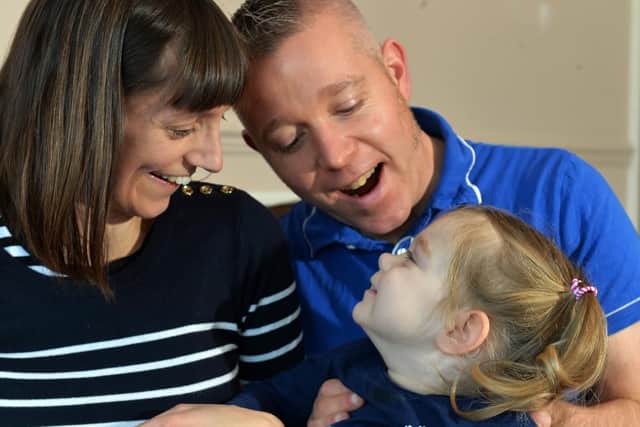 Zoe Lightfoot with parents Christine and Steven.