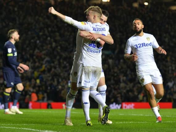 Leeds United celebrate at Elland Road following Jack Harrison's goal against Derby County.