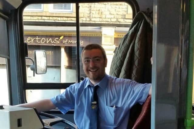Train driver Bradley MacMullan driving his 50 seater Black Prince bus