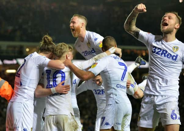 Jack Harrison celebrates his goal with his Leeds United team-mates.