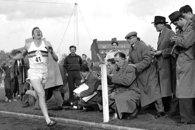 FILE - In this May 6, 1954 file photo, Britain's Roger Bannister hits the tape to become the first person to break the four-minute mile in Oxford, England. A statement released Sunday March 4, 2018, on behalf of Bannister's family said Sir Roger Bannister died peacefully in Oxford on March 3, aged 88. (AP Photo, File)