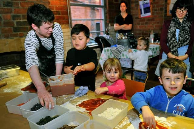 Youngsters making pizza at The Belgrave Vegan Feast