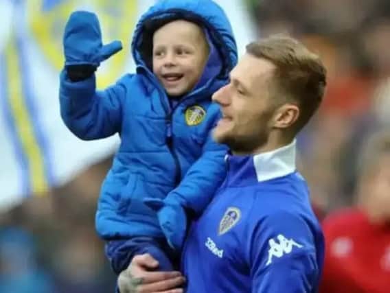 Toby Nye with Leeds United captain Liam Cooper.