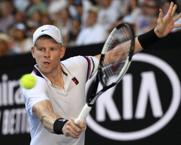 Going out: Britain's Kyle Edmund makes a backhand return to Tomas Berdych. Picture: AP Photo/Andy Brownbill