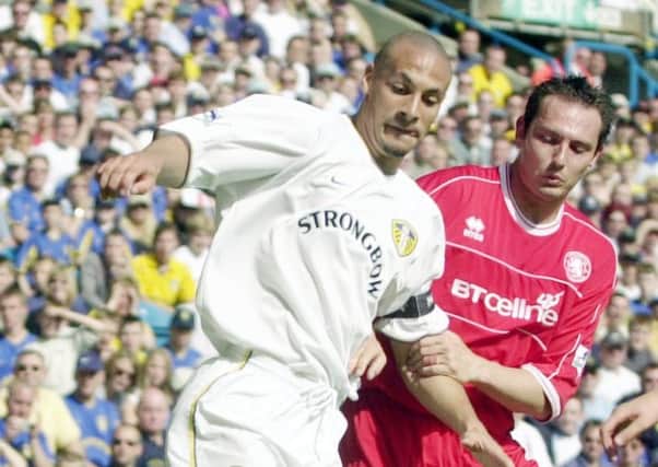 MAY 2002:  Rio Ferdinand battles for the ball with Noel Whelan.