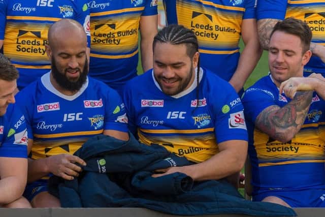 Konrad Hurrell uses some blankets to help him stay warm during the Leeds Rhinos media day.