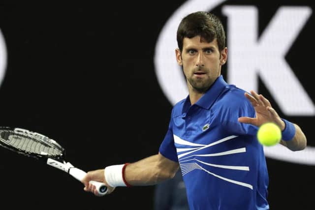 Serbia's Novak Djokovic makes a forehand return to France's Jo-Wilfried Tsonga during their second round match in Melbourne. Picture: AP/Aaron Favila.