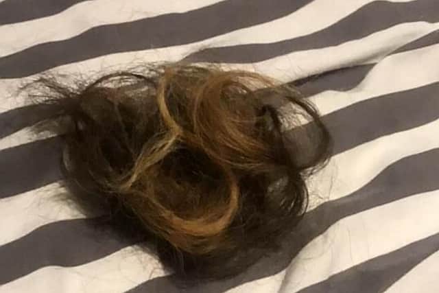 The mortified teenager was left with a pile of her luscious long hair on her bed, and burst into tears. PIC: SWNS
